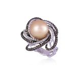 A CULTURED SOUTH SEA PEARL AND DIAMOND RING