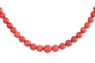 A RED CORAL BEAD STRAND ON SILVER CLASP