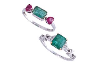 TWO EMERALD AND GEMSTONE DRESS RINGS