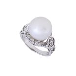 A CULTURED SOUTH SEA PEARL AND DIAMOND RING