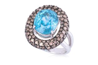 A BLUE ZIRCON AND 'CHAMPAGNE' DIAMOND RING