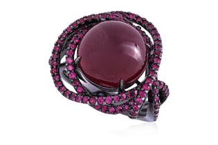A GLASS FILLED RUBY RING