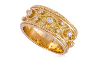 A DIAMOND AND GOLD RING BY J. YANES