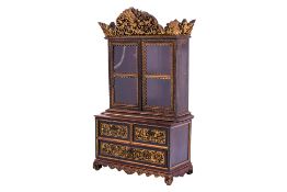 A CARVED AND GLAZED GILT WOOD CABINET OF SMALL PROPORTIONS