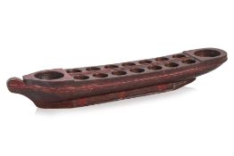 A CARVED WOOD CONGKAK (MANCALA) BOARD IN THE FORM OF A BOAT