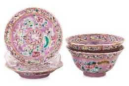 A PAIR OF 'IN AND OUT' FAMILLE ROSE TEA BOWLS AND SAUCERS