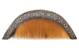 A REPOUSSE SILVER MOUNTED COMB