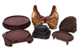 A GROUP OF SIX WOODEN STANDS