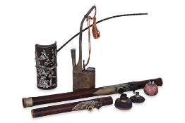 A GROUP OF VARIOUS SMOKING PIPES AND RELATED IMPLEMENTS