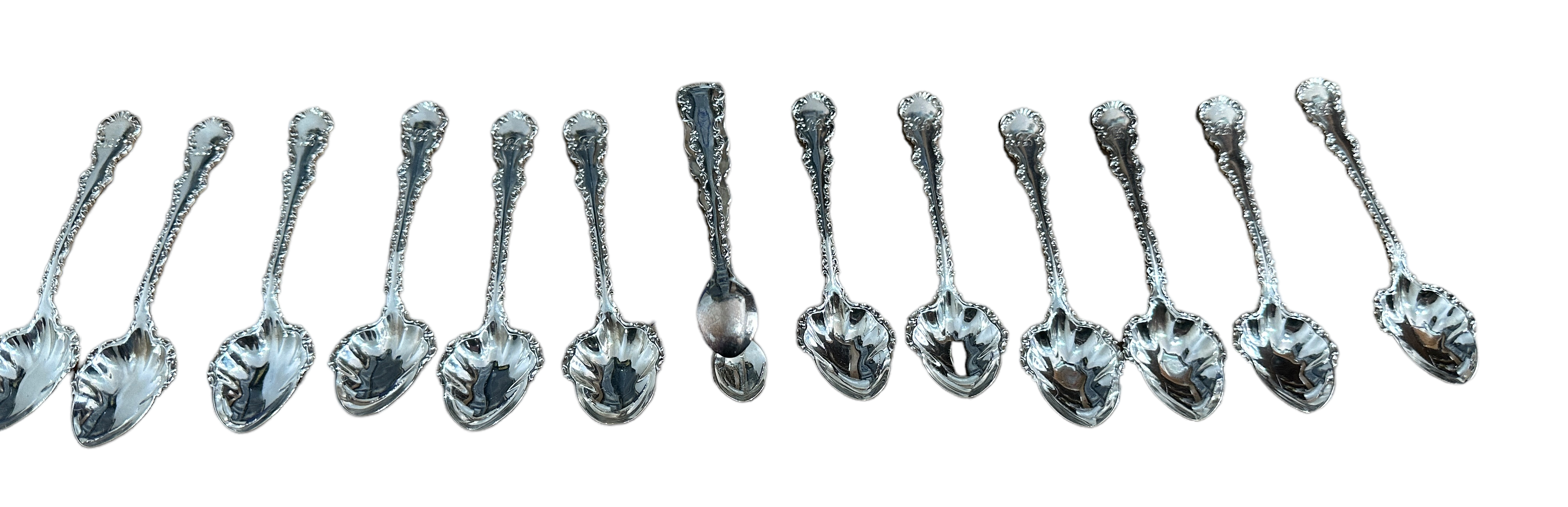 Lot of 12 Decorated Silver Spoons and Silver Tongs - Spoons 11.8 cm long.