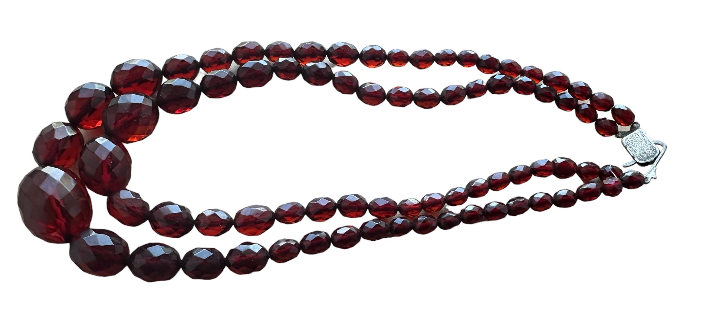 Vintage String of Cherry Amber/Bakelite Beads(Silver Clasp) - 78cm long and approx 48 grams weight