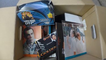A James Bond selection including lobby cards, stickers, cards, promotional material, etc.