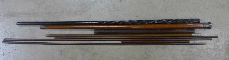 A wooden cane with white metal top, an auctioneers stick, Boys Brigade swagger stick, carved
