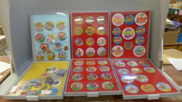 A collection of Wimpy badges, film badges, all in display/collectors cases