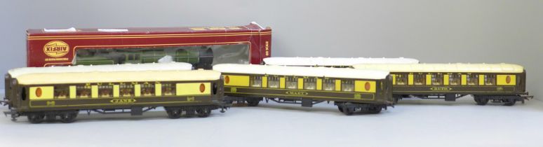 A Tri-ang 00 gauge model locomotive, (Airfix box), and five Pullman coaches