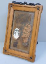 A circa 1900 walnut photograph frame