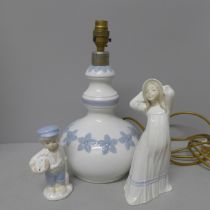 A Lladro table lamp base, a D'Art Spanish figure and one other figure