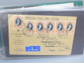 Stamps; an album of Queen Elizabeth II Commonwealth first day covers and postal history, 1953 to