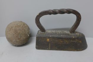 A Hughes Liverpool cast iron flat iron and a cannon ball