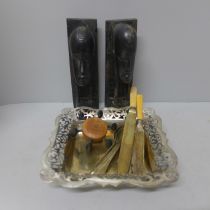 A Danish candle holder, a pair of carved African busts, silver plated dish and flatware **PLEASE