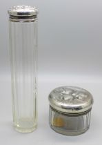 A silver topped glass jar by William Comyns and a silver topped bottle, both with Reynolds Angels