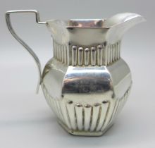 A Victorian silver jug with fluted decoration, Birmingham 1898, 55g