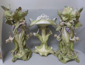 A pair of tall German Art Nouveau figural vases and a tall figural pedestal dish, a/f (damage to