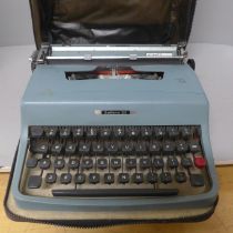 A cased Olivetti Lettera 32 typewriter **PLEASE NOTE THIS LOT IS NOT ELIGIBLE FOR POSTING AND