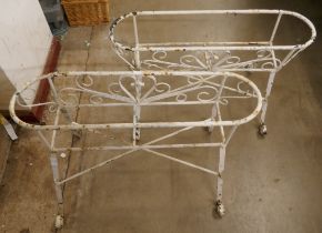 A pair of Victorian wrought iron garden planters