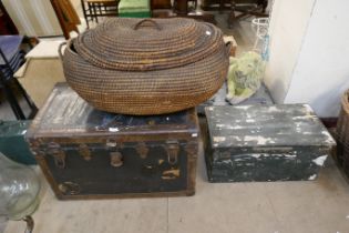 A wicker lidded basket and two trunks