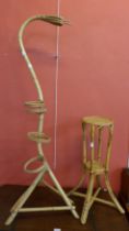 A bamboo snake shaped plant stand and one other