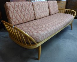 An Ercol Blonde elm and beech 355 model studio couch