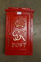 A red painted cast iron Post Office letter box, with key