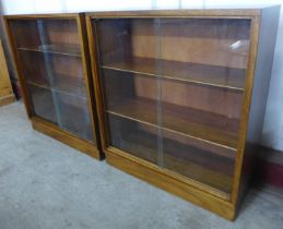 A pair of Morris of Glasgow tola wood bookcases