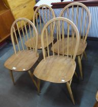 A set of four Ercol Blonde elm and beech Windsor chairs