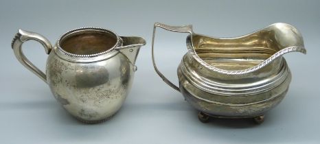 A continental silver jug with foreign control marks and a 19th Century silver cream jug, a/f,