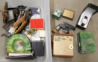 A box of assorted items; a Lone Star toy gun, a Kodak Brownie camera, a smoking set, watches,