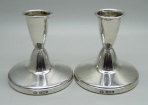 A pair of small silver candlesticks, Birmingham 1985