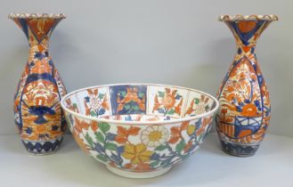 A pair of Imari vases, 25cm, one restored and an Imari bowl with six character mark to base