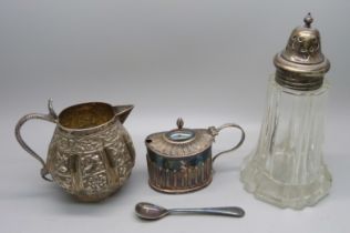 A Victorian silver mustard, 48g, (plated spoon), an Indian white metal jug with snake handle,