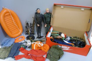 Two vintage Action Man figures, dinghy and a collection of accessories