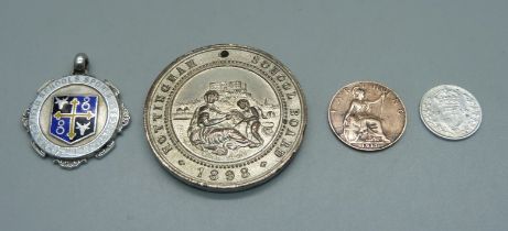 A 1914 silver 3d coin, a 1917 farthing, a silver and enamel fob medal marked Mansfield Schools