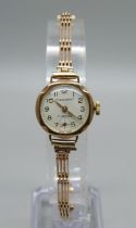 A lady's 9ct gold cased President wristwatch on a 9ct gold bracelet, weight without movement 10.4g