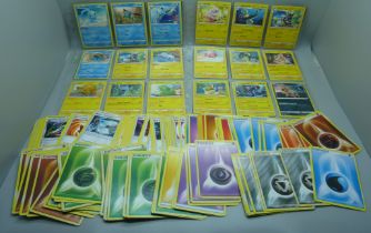 Over 300 Pokemon cards in protective sleeves