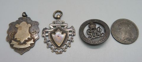 Two large silver fob medals, a silver wound badge, 38304, lacking pin, and a silver 1884 Colombian