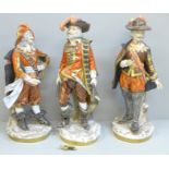 A set of three German Unter Weiss Bach figures of the Three Musketeers, one sword on one figure a/f