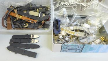 A tin of wristwatch straps and a tub of leather and man made wristwatch straps including Seiko and
