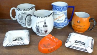 A collection of Scotch Whisky advertising items including Shelley water jugs and three ash trays