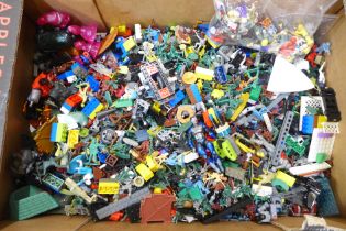 A collection of Lego, toy soldiers and a bag of mini figures