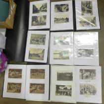 A large collection in fifteen albums of approximately 350 original real photo postcards covering